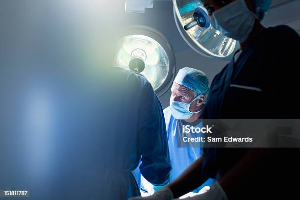 Surgeons Working In Operating Room Stock Photo - Download Image Now - Surgery, Surgeon, Doctor