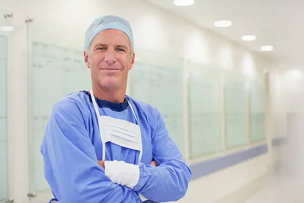 Photo of Portrait of smiling surgeon in hospital corridor