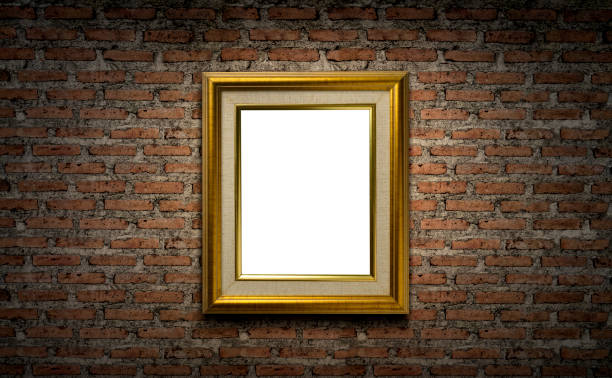 istock Golden picture frame on dark brick wall 1518179338
