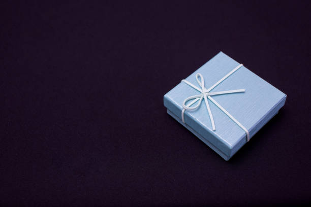 istock Christmas gift boxes isolated on black background, except copy space. 1518181438