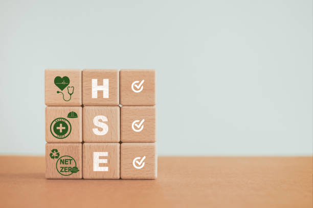 istock For Health, Safety and Environment concept, HSE text and icon with correct sign on stack of  wooden cube block including copy space 1518254961