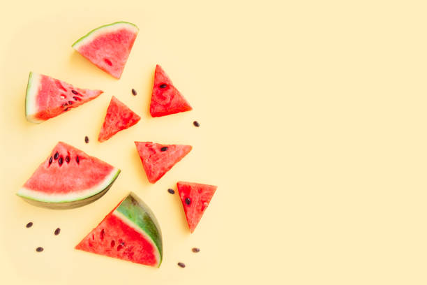 istock Watermelon fruit sliced isolated on yellow background, Organic fruit, Watermelon pieces 1518281849