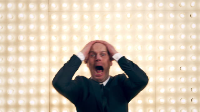 Man screaming in front of lightwall