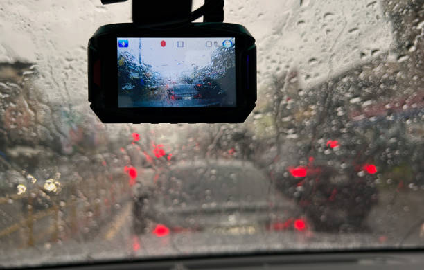 Raindrops on windshield from inside the car in traffic jam stock photo