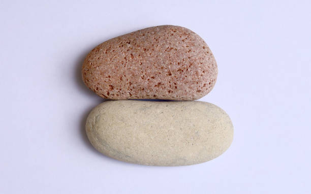 istock Red and white peeble stone isolated on white background 1518338991