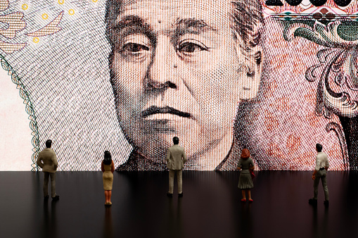 Businessman/Politician figurines scrutinize the Japanese Yen on screen (Economy of Japan)