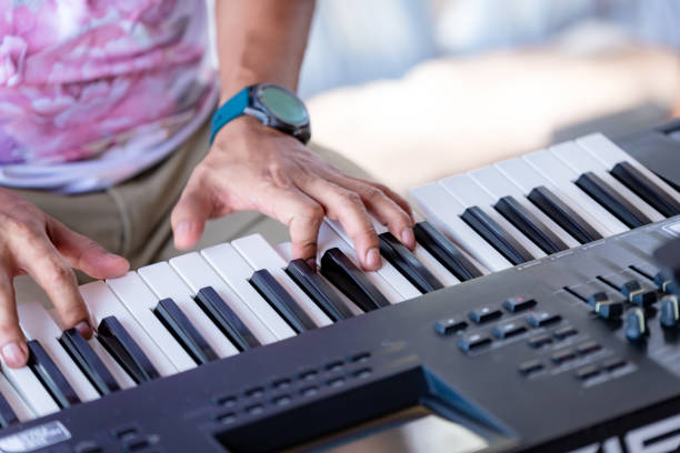 istock Musician's hands playing the piano 1518393824
