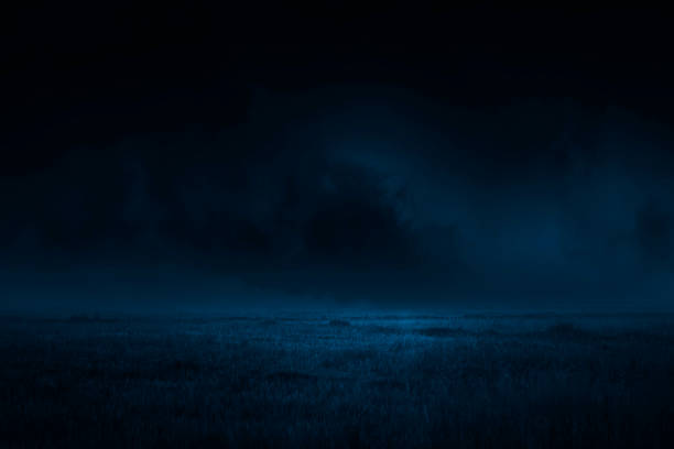 istock lawn and dark cloud nature background 1518418943