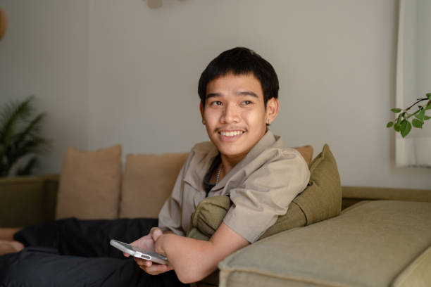 istock Young man relaxing after work at home. 1518452047