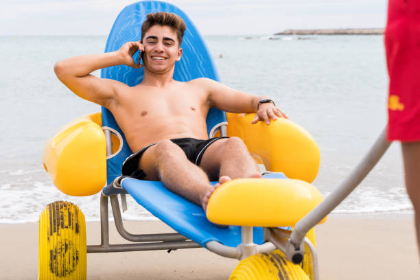 istock Man rescued on the beach talking with the mobile phone 1518481008