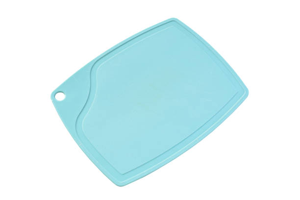 istock blue plastic cutting board isolated on white background, equipment for cooking in the kitchen 1518487679