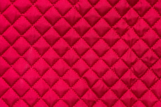 istock red stitched quilted bag cloth background close up 1518501258