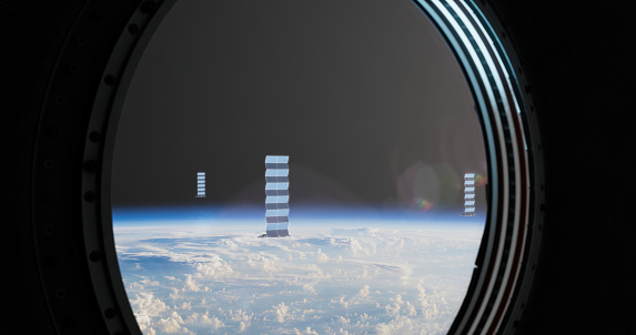 Through the spacecraft's porthole, a captivating sight emerges as clusters of small space stations come into view. The window, meticulously designed for cosmic observation, offers a glimpse of these orbital habitats suspended against the backdrop of the vast universe.