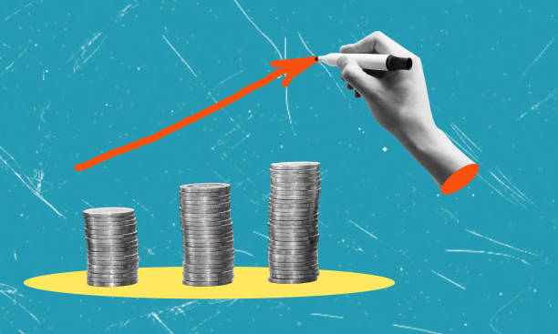 istock stacks of coins and growth graph. Hand draws a graph of growth. 1518531435