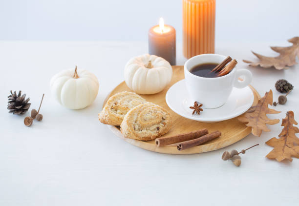 istock white cup of coffee with cozy decor on white table 1518562480