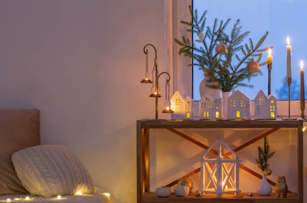 istock beautiful white room with christmas decor with burning candles 1518562484