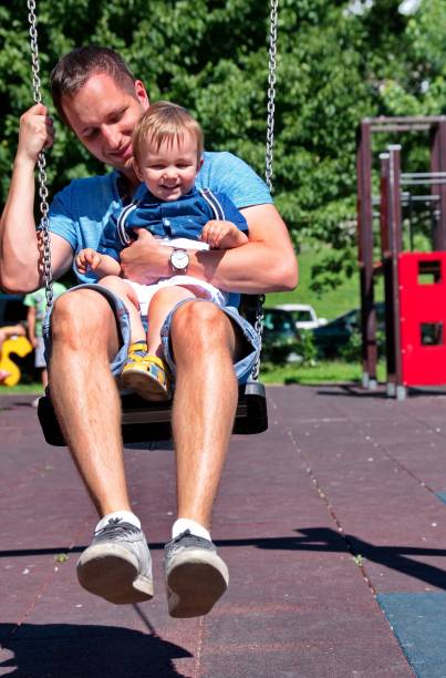 istock Father swinging with his little boy 1518586845