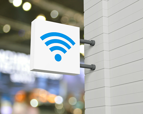 Wi-fi flat icon on hanging white square signboard over blur light and shadow of shopping mall, Technology internet communication concept, 3D rendering