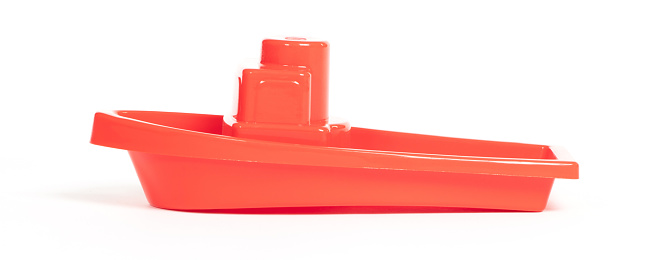 Plastic toy boat isolated on a white background