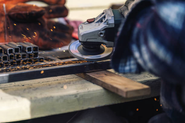 istock Grinding a metal frame with a grinder, close-up shot 1518616685