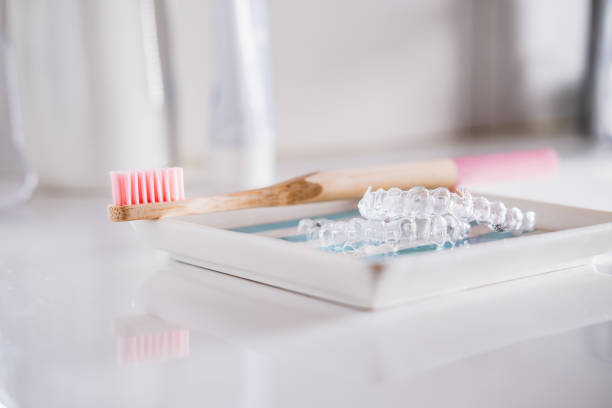 istock Transparent dental aligner and toothbrush. 1518650022