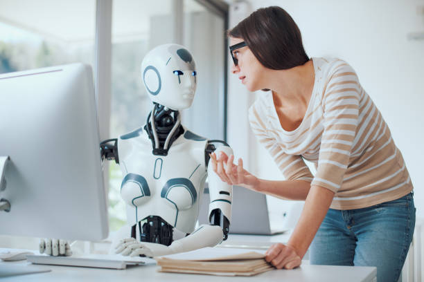 istock Woman and AI robot working together 1518650561