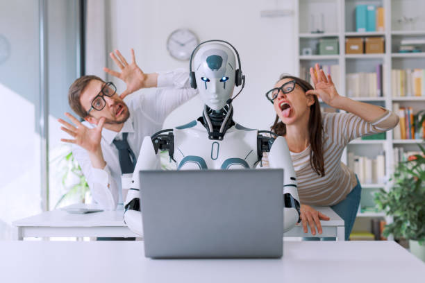 istock Office workers mocking their robot colleague 1518651587