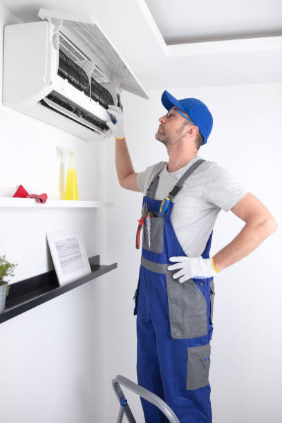istock Service guy cleaning and maintaining air condition unit. 1518663518