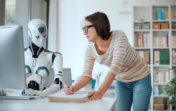 istock Woman and AI robot working together 1518664567