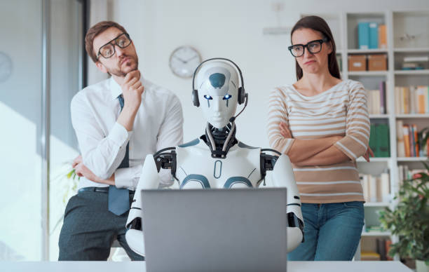 istock Business people supervising a robot work 1518665092