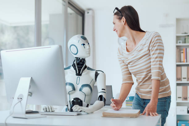 istock Woman and AI robot working together 1518669768