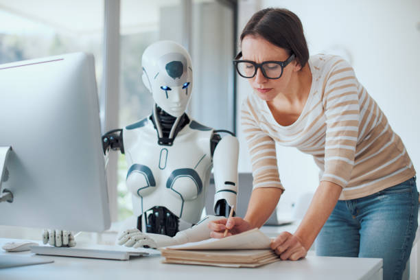 woman and ai robot working together - ai stok fotoğraflar ve resimler