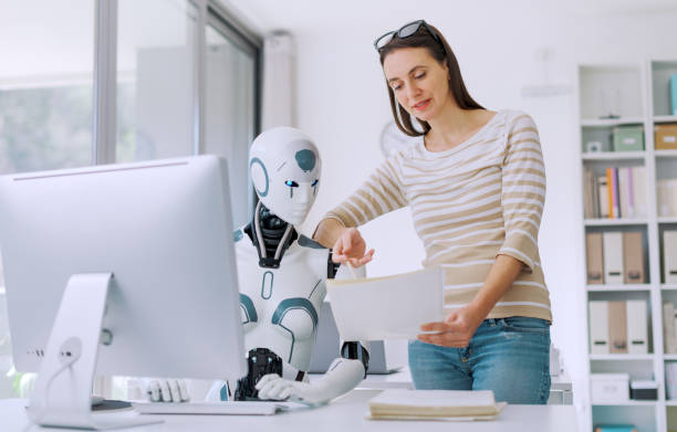 istock Woman and AI robot working together 1518672393