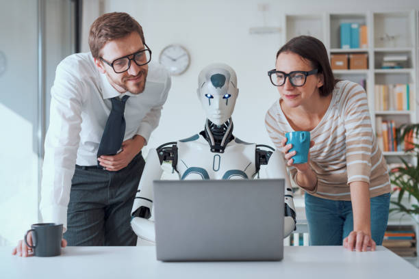 istock Business people supervising a robot work 1518675159