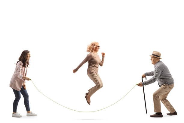 istock Elderly father playing skipping rope with his daughters 1518683700