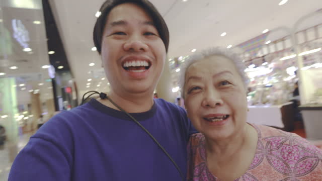 Mother and son in a shopping mall