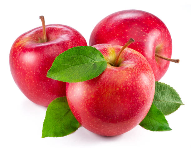 istock Ripe red apples with green leaves isolated on white background. 1518693136
