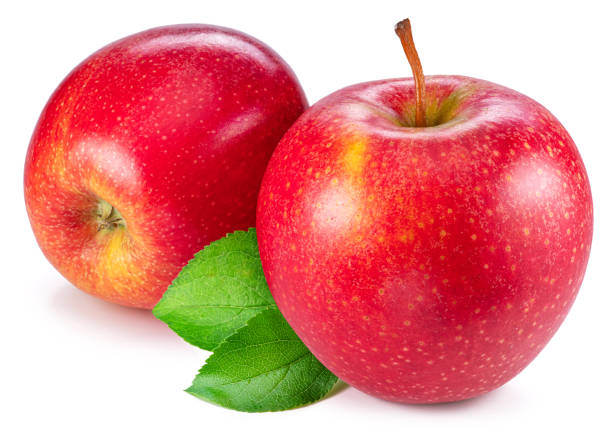 istock Two ripe red apples with green leaves isolated on white background. 1518693149