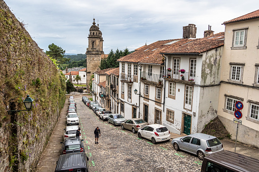 Santiago de Compostela, Spain - Jun 18, 2023: The narrow, cobbled Hortas Street, Rua das Hortas is the first stage of Camino Finisterre at Santiago de Compostela, Galicia, Spain