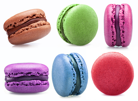 Colorful french macaroon cookies isolated on white background.