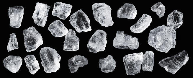 Salt crystals macro, isolated on black background.