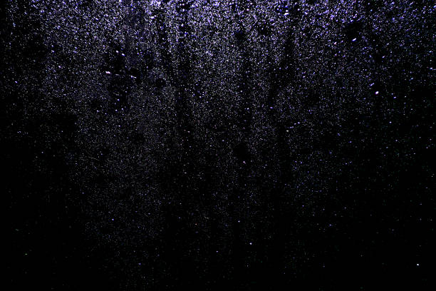 istock Black dark white orange red brown shiny glitter abstract background with space. Twinkling glow stars effect. Like outer space, night sky, universe. Rusty, rough surface, grain. 1518711115