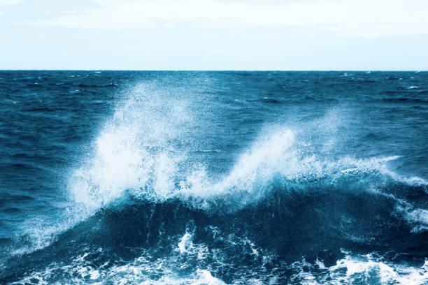 istock Ocean water background with foam. Ocean water splash. Not a calm 1518778726