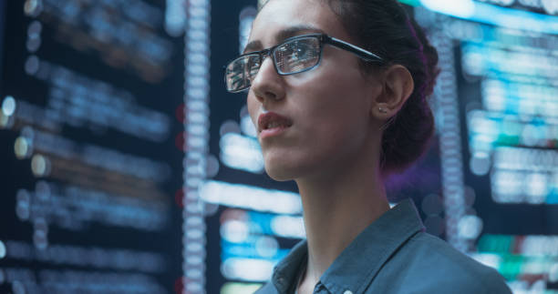 istock Close Up Portrait of Woman Working on Computer, Lines of Code Language Reflecting on her Glasses from Big Display Screens. Female Programmer Developing New Software, Coding, Managing Cybersecurity 1518860092