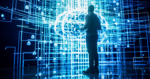 istock Back View of Young Man Looking at a Big Screen with Neural Network 3D Visualisation. Professional Computer Data Science Engineer Working in System Control and Monitoring Telecommunications 1518874019