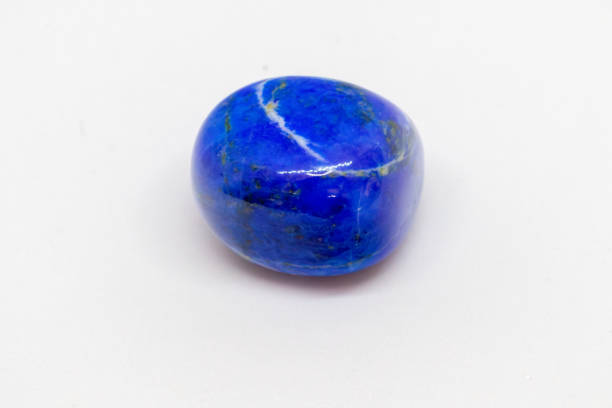 istock Lapis lazuli, power gemstone, on white background 1518908713