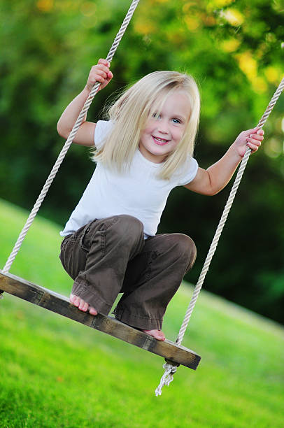 istock Little Girl on Swing 151897483