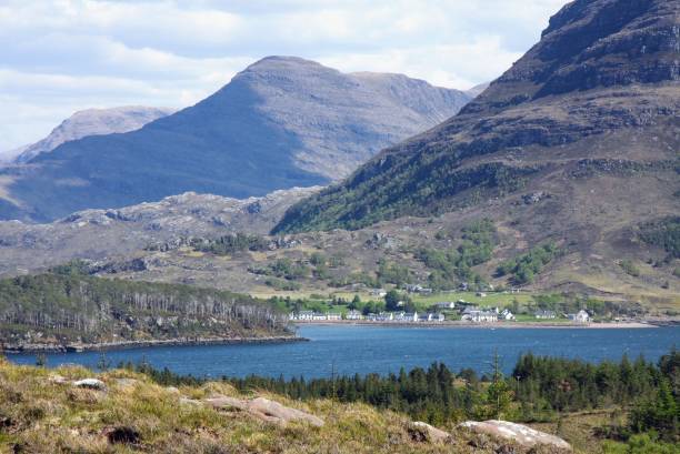 istock Scottish Loch with Mountains Behind 1518984117