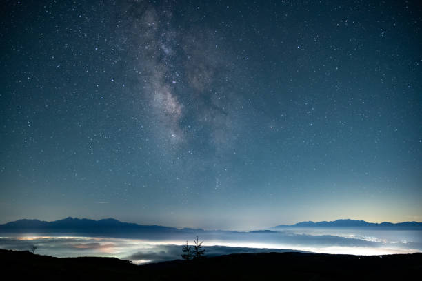 istock sea of clouds and milky way 1518989396