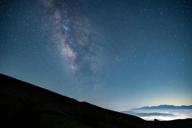 istock sea of clouds and milky way 1518989409